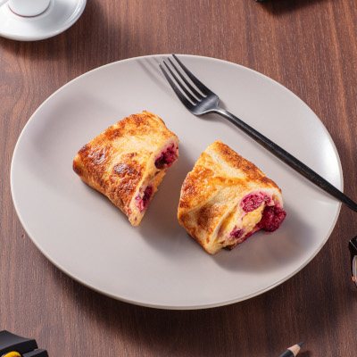 Finnish pancake with sweet cream and raspberry